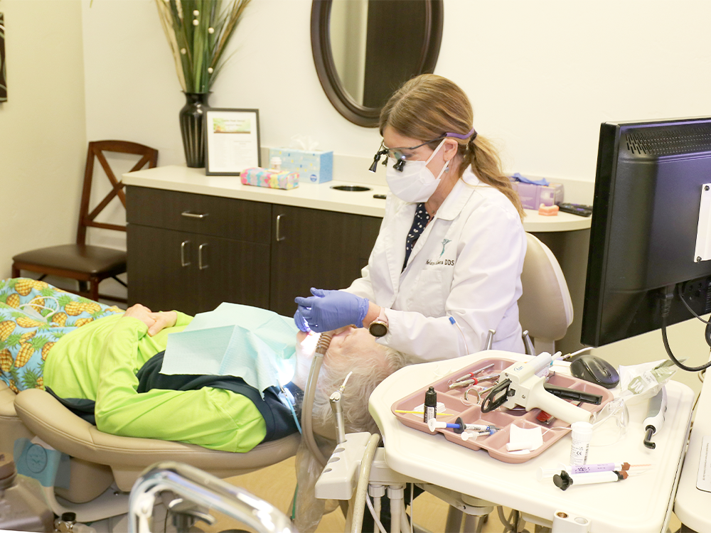 doctor working on patients teeth
