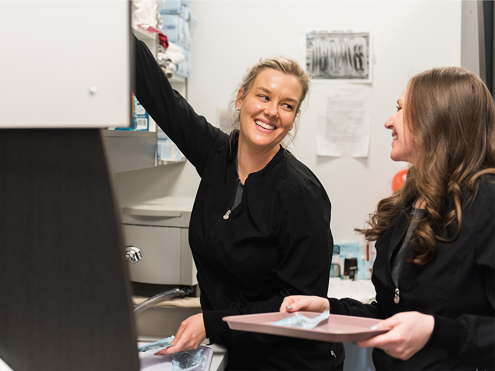 two dental hygienist smiling