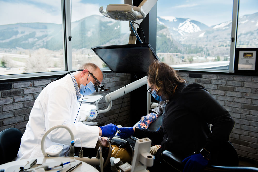 dr drescher working on patients teeth